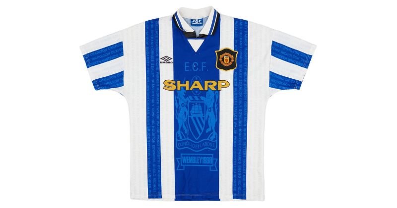 Manchester united blue and white striped third shirt 1994-96 with player names written on blue stripes and european cup tribute in the middle